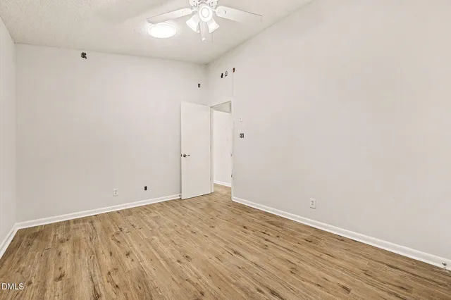 a bed room with a bed and a chandelier