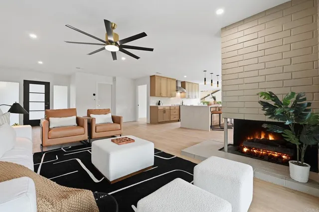 a view of a green field with wooden fence