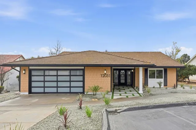 a kitchen with stainless steel appliances white cabinets and a sink