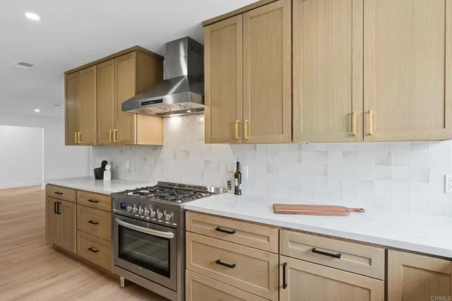 a view of a dining room with furniture wooden floor and chandelier