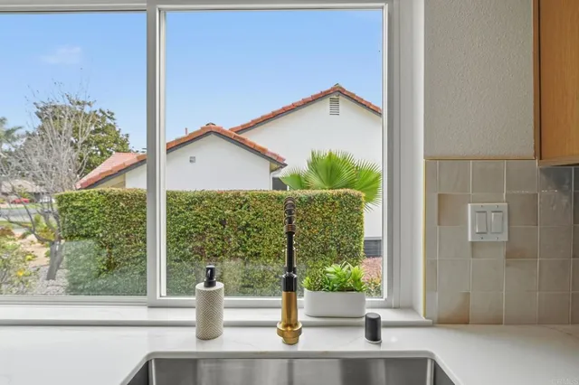 a bedroom with a bed and a large mirror