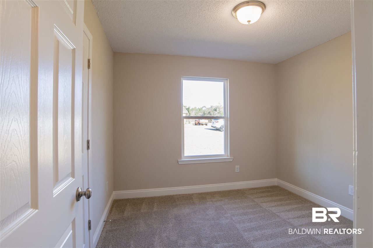 9141 Semmes Court Semmes, AL 36575 - Photo 21 of 28 Second guest bedroom has new carpet and paint.