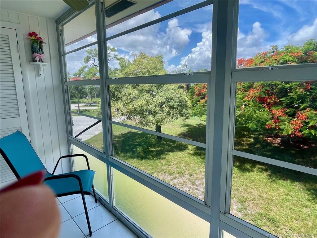 2600 Southeast Ocean Boulevard, Unit A12 Stuart, FL 34996 - Photo 13 of 17 a view of a glass door with a bench