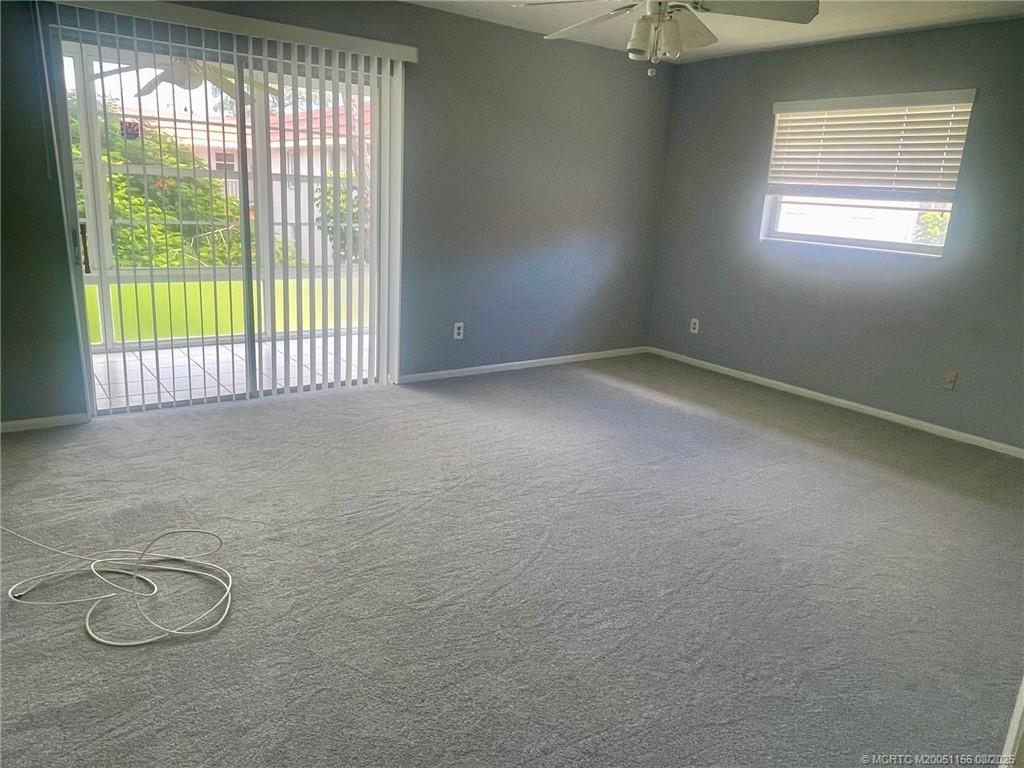2600 Southeast Ocean Boulevard, Unit A12 Stuart, FL 34996 - Photo 17 of 17 an empty room with windows and closet