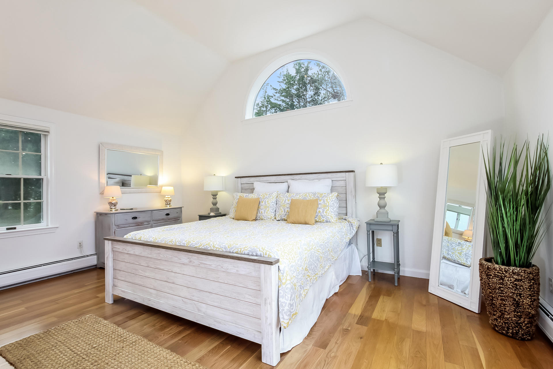 12 Governor Prence Road Brewster, MA 02631 - Photo 16 of 32 a bedroom with a bed and a potted plant