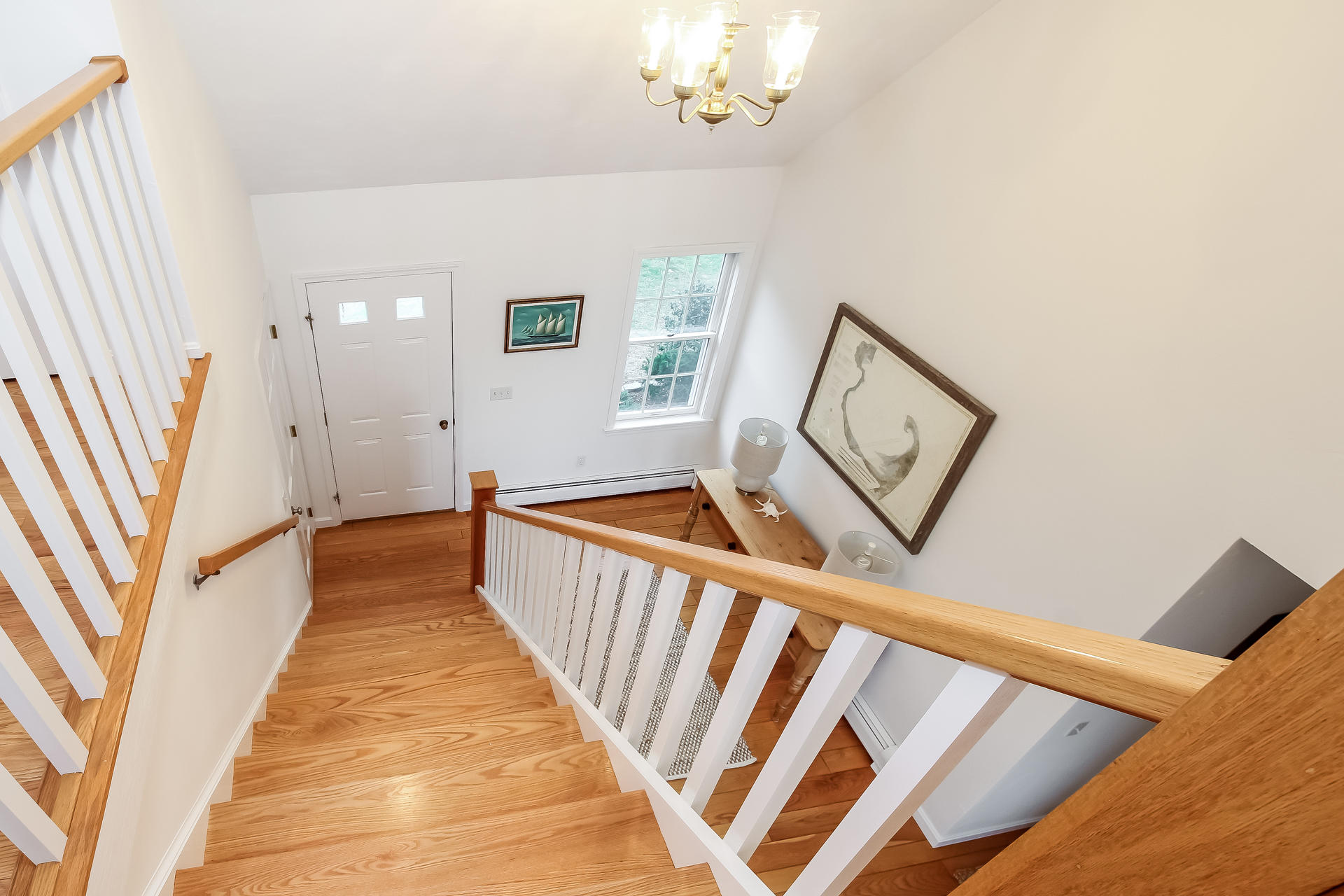 12 Governor Prence Road Brewster, MA 02631 - Photo 18 of 32 a view of a hallway with wooden floor and staircase