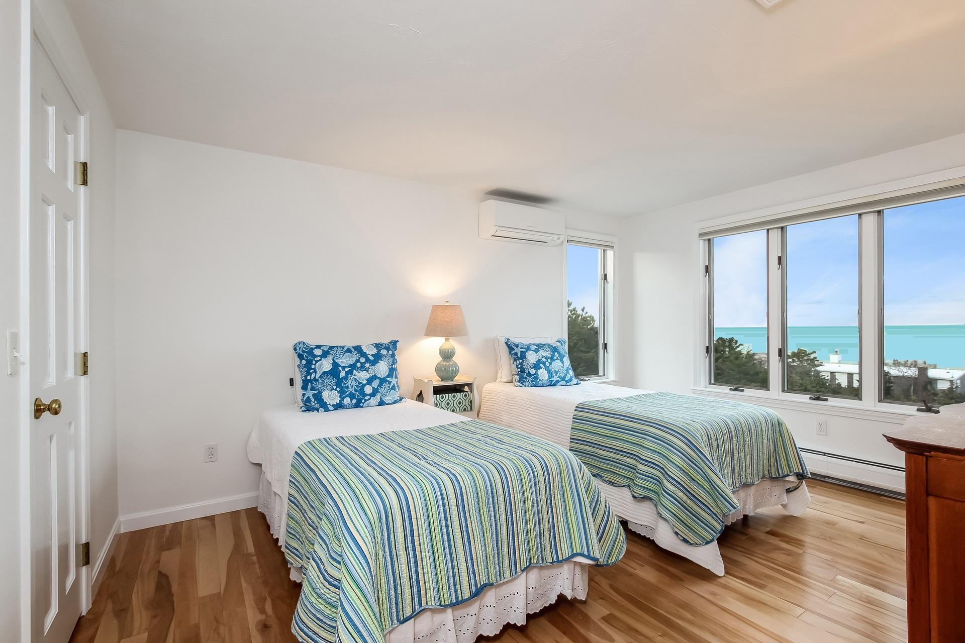 12 Governor Prence Road Brewster, MA 02631 - Photo 19 of 32 a bedroom with a bed and a large window