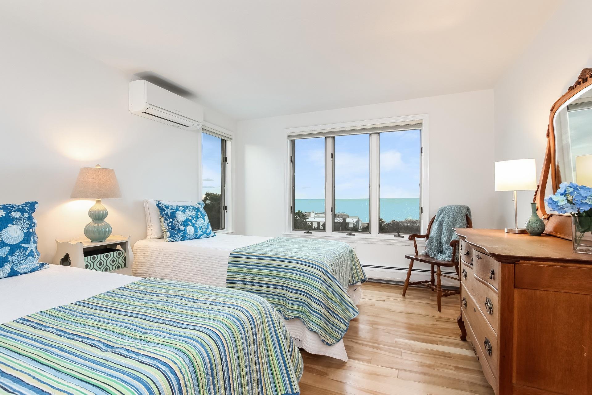 12 Governor Prence Road Brewster, MA 02631 - Photo 20 of 32 a bedroom with a bed and wooden floor