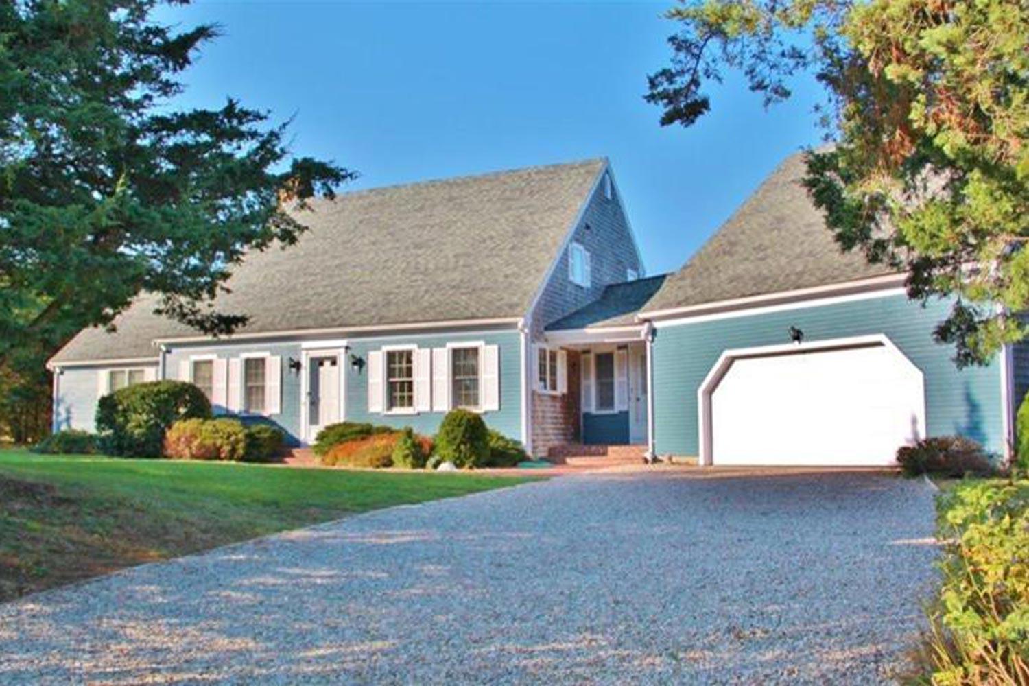 12 Governor Prence Road Brewster, MA 02631 - Photo 2 of 32 a front view of a house with garden
