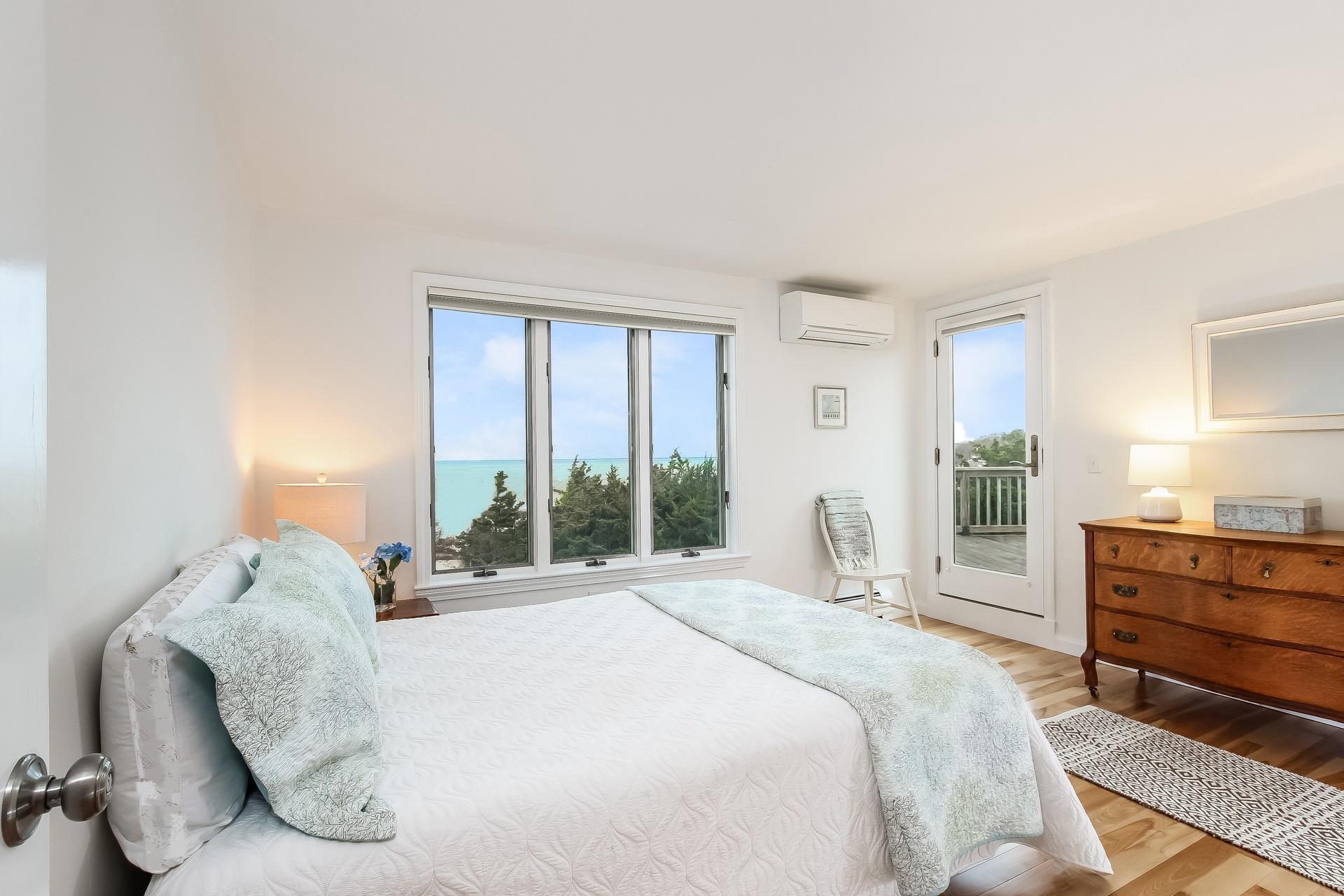 12 Governor Prence Road Brewster, MA 02631 - Photo 21 of 32 a bedroom with a bed and a large window