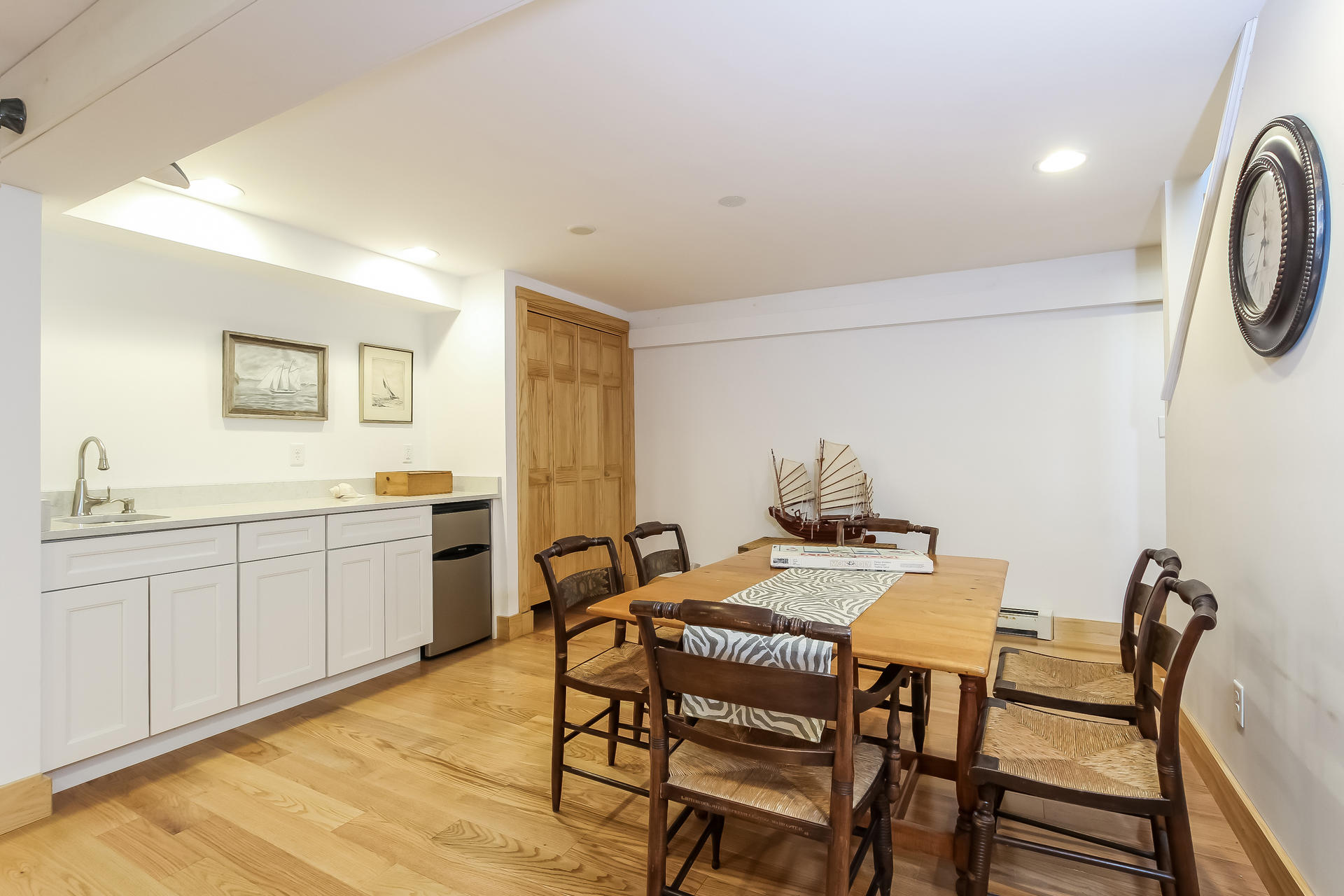 12 Governor Prence Road Brewster, MA 02631 - Photo 27 of 32 a view of a dining room with furniture and a chandelier