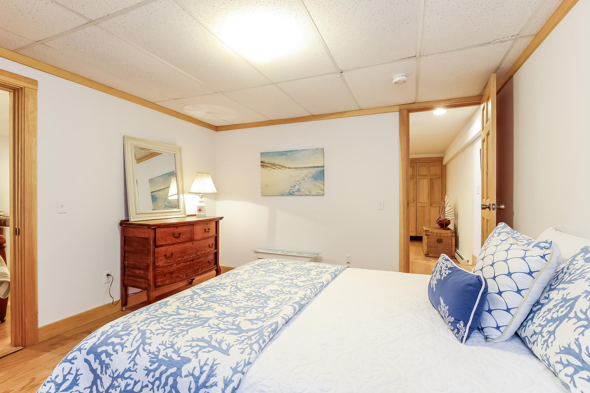 12 Governor Prence Road Brewster, MA 02631 - Photo 30 of 32 a bedroom with a large bed and a dresser