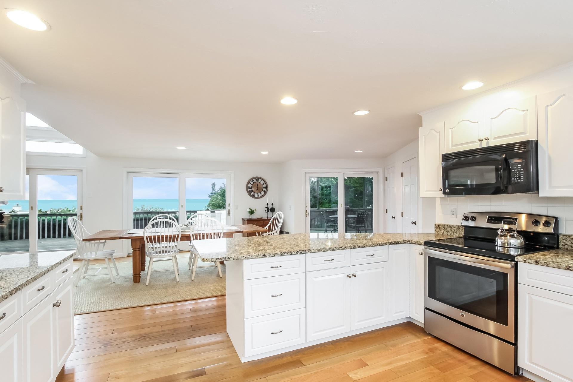 12 Governor Prence Road Brewster, MA 02631 - Photo 10 of 32 a kitchen with a sink stove and microwave