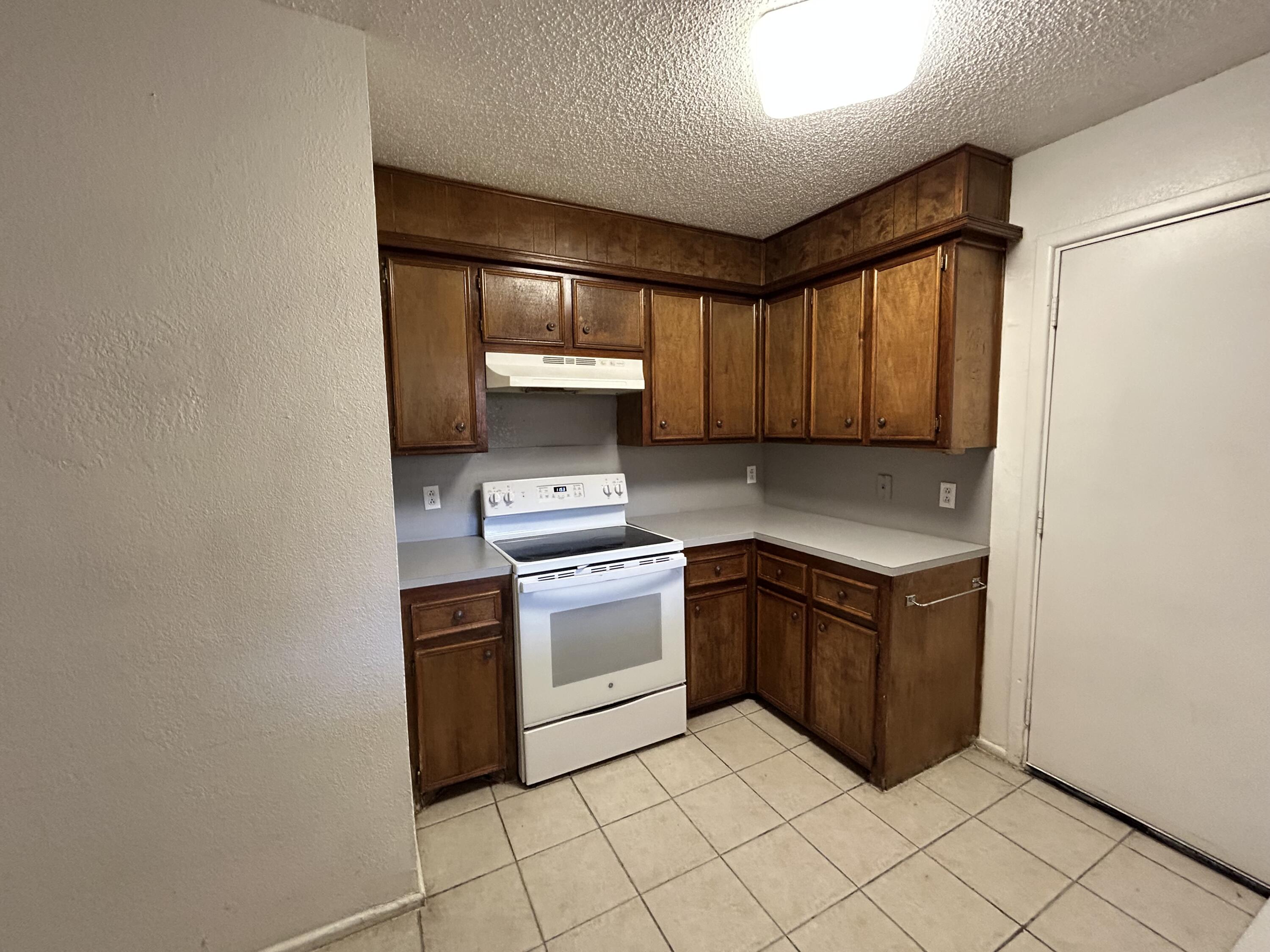 1303 80th Street, Unit A Lubbock, TX 79423 - Photo 4 of 16 IMG_0221