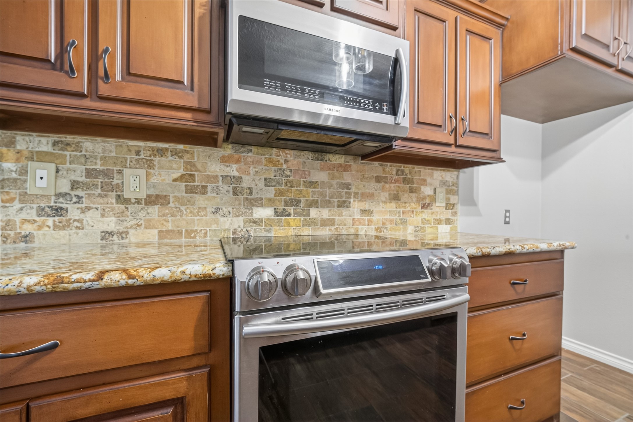 1007 West Cedar River Road Conroe, TX 77316 - Photo 13 of 48 a stove top oven sitting inside of a kitchen