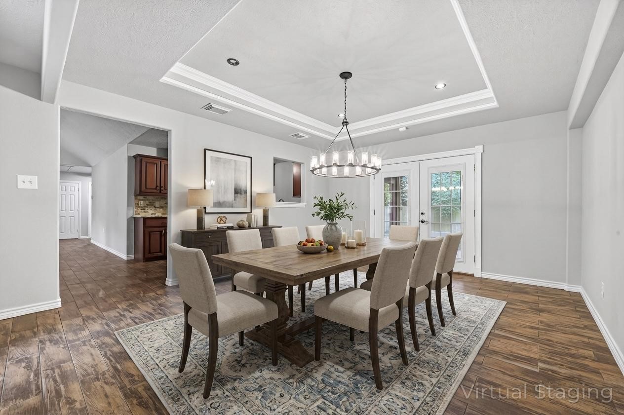1007 West Cedar River Road Conroe, TX 77316 - Photo 17 of 48 a view of a dining room with furniture window and wooden floor