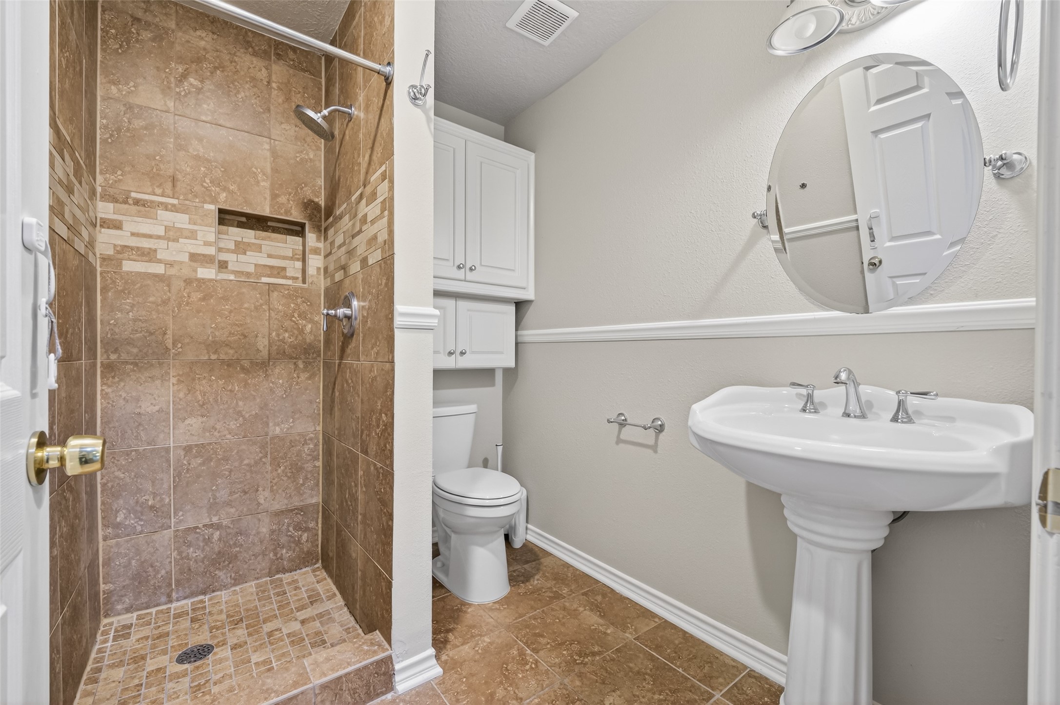 1007 West Cedar River Road Conroe, TX 77316 - Photo 26 of 48 a bathroom with a sink toilet and shower