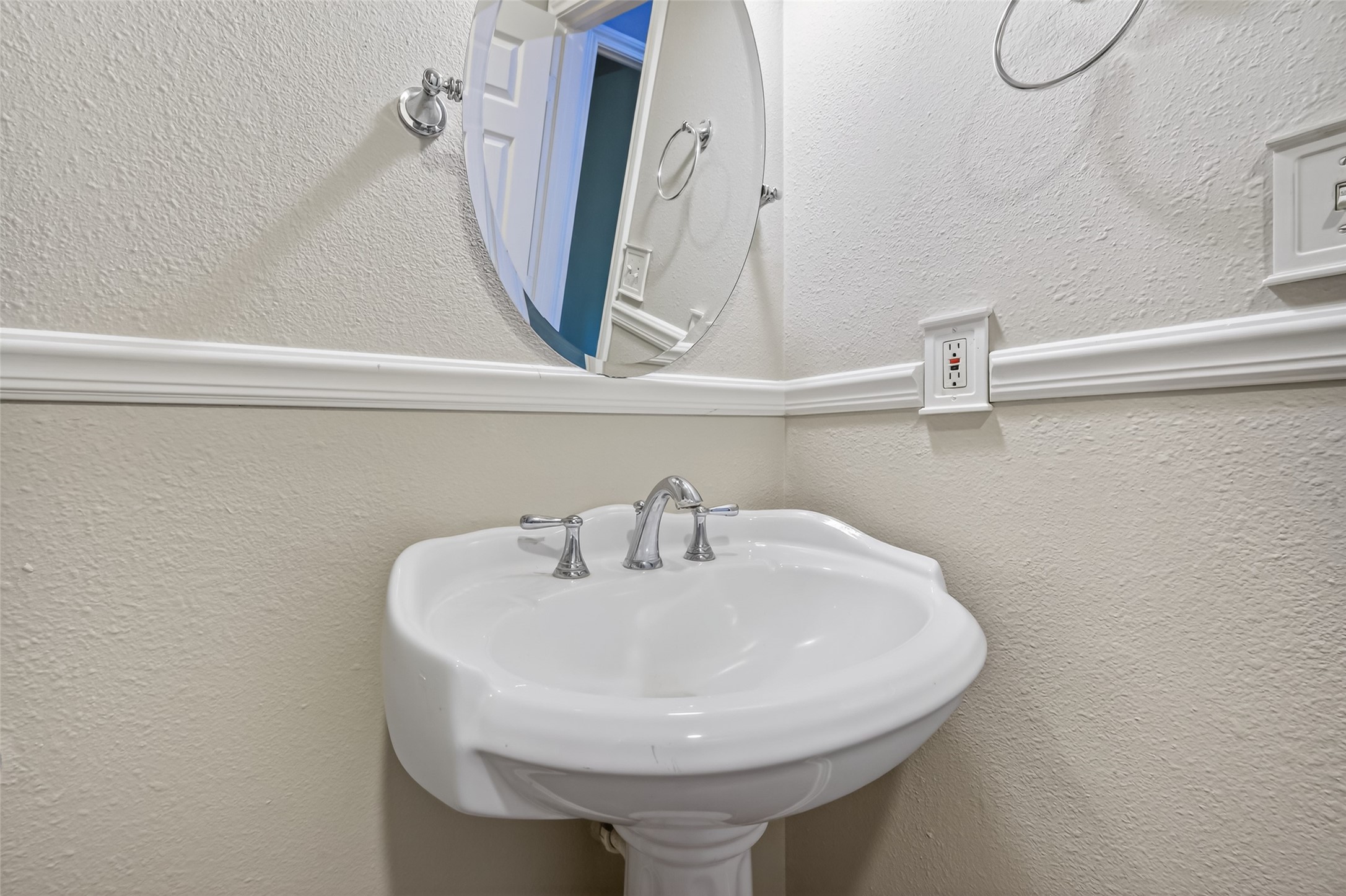 1007 West Cedar River Road Conroe, TX 77316 - Photo 28 of 48 a bathroom with a sink and a mirror