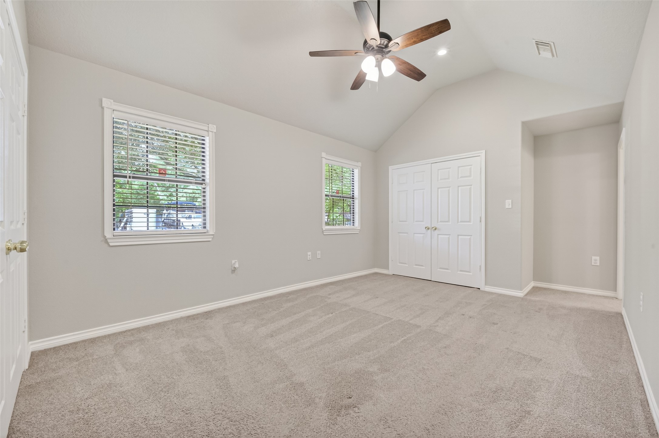 1007 West Cedar River Road Conroe, TX 77316 - Photo 30 of 48 an empty room with windows and fan