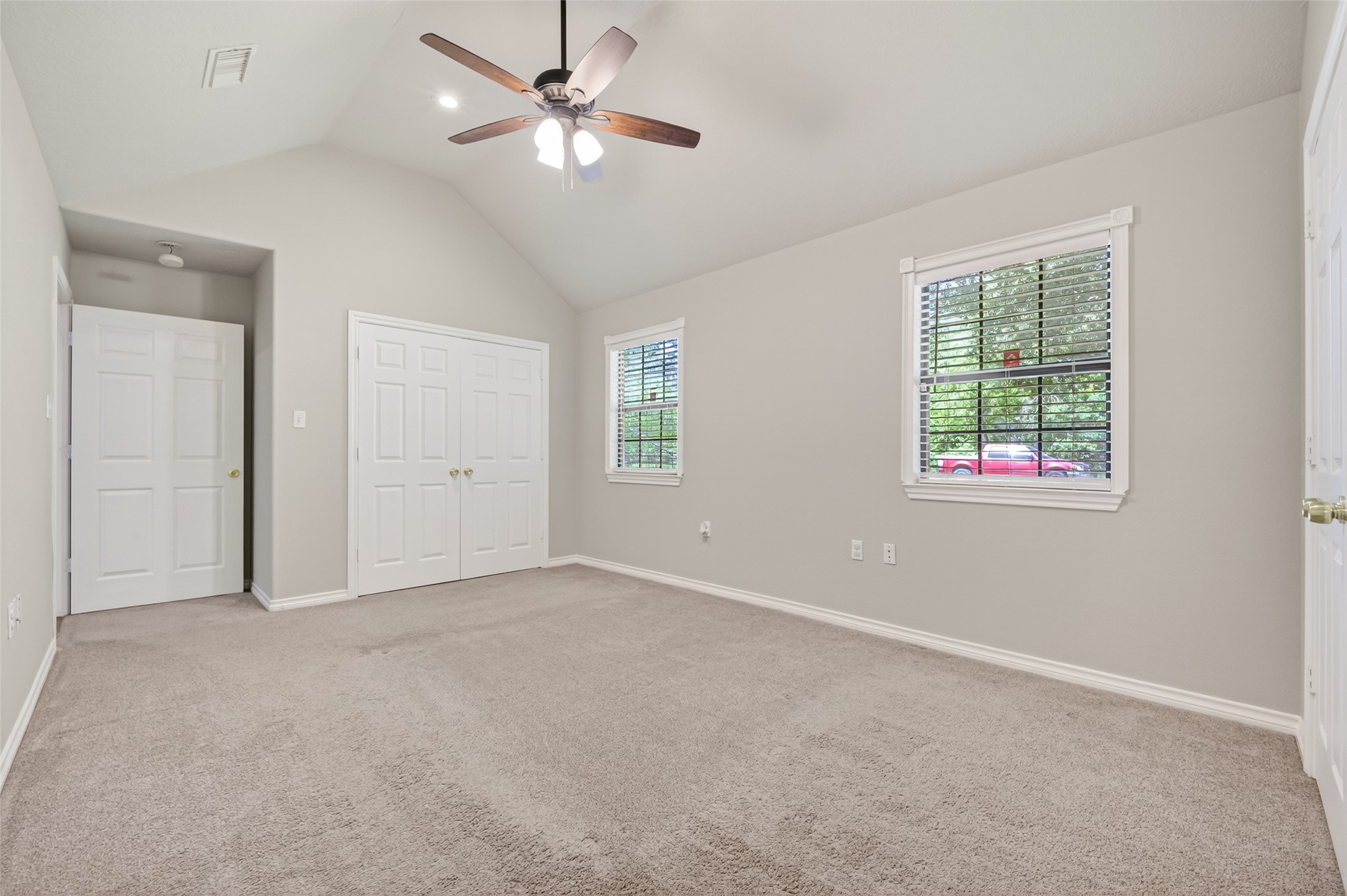 1007 West Cedar River Road Conroe, TX 77316 - Photo 32 of 48 an empty room with windows and fan
