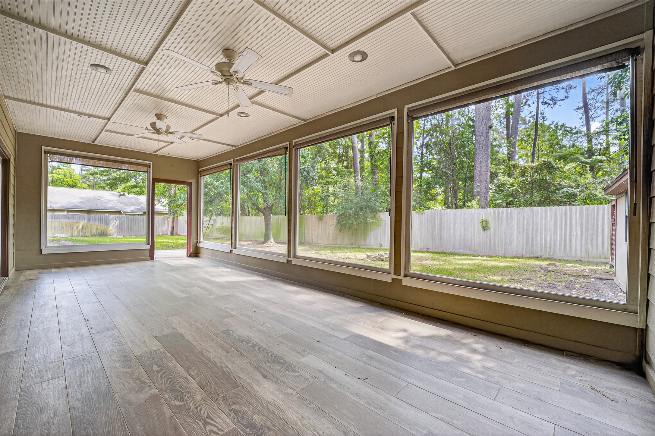 1007 West Cedar River Road Conroe, TX 77316 - Photo 35 of 48 a view of room with wooden floor and outdoor space