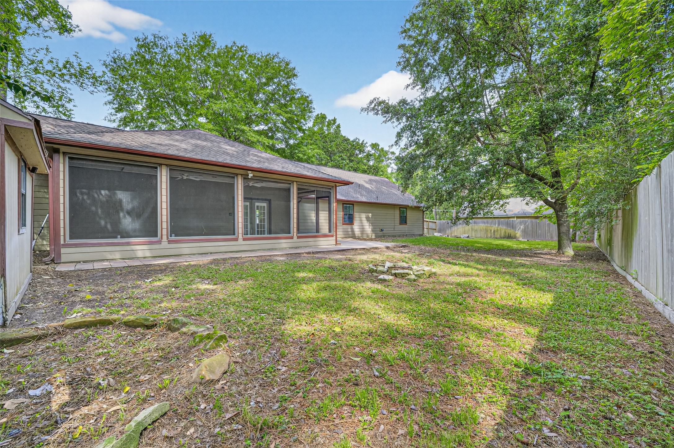 1007 West Cedar River Road Conroe, TX 77316 - Photo 41 of 48 a house with huge green field in front of it