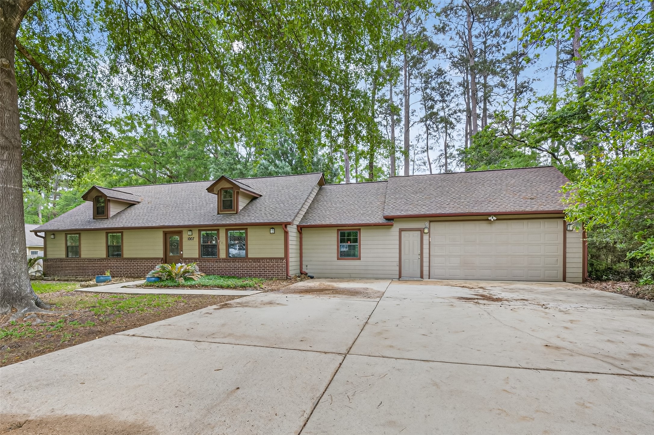 1007 West Cedar River Road Conroe, TX 77316 - Photo 42 of 48 front view of a house with a street