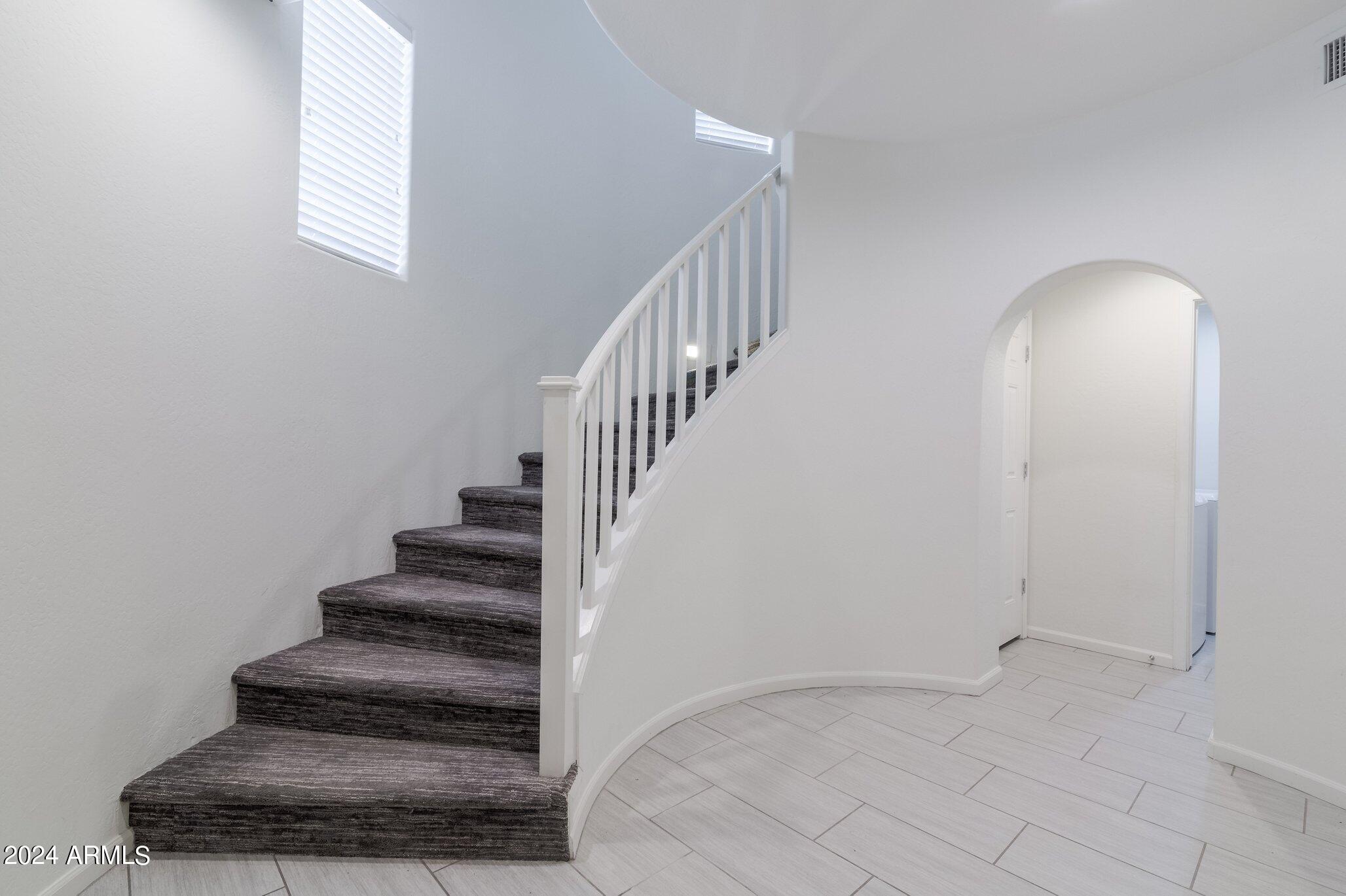 3935 East Rough Rider Road, Unit 1253 Phoenix, AZ 85050 - Photo 10 of 22 Rough Rider Grand Staircase