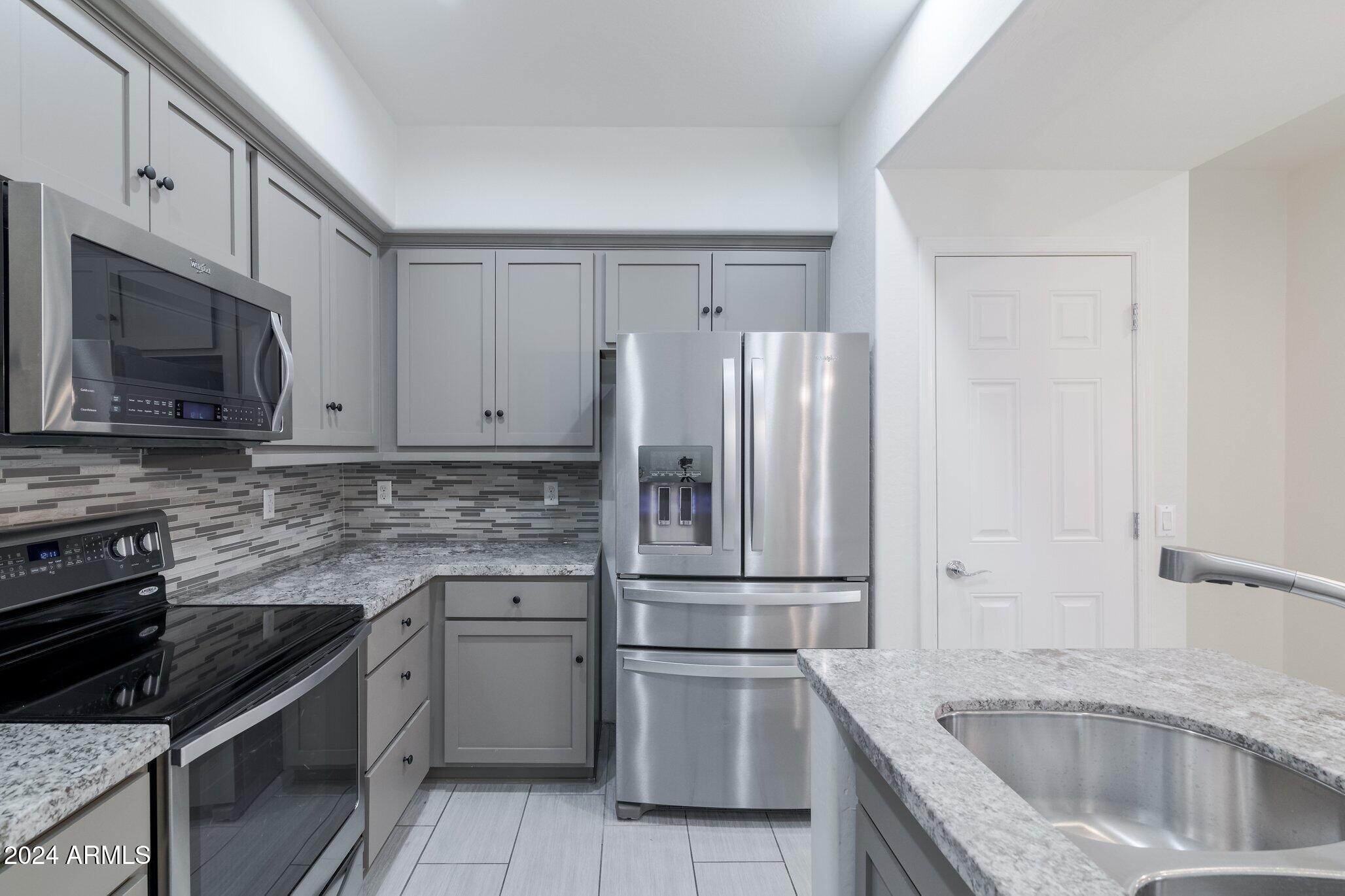 3935 East Rough Rider Road, Unit 1253 Phoenix, AZ 85050 - Photo 5 of 22 Rough Rider Kitchen 2