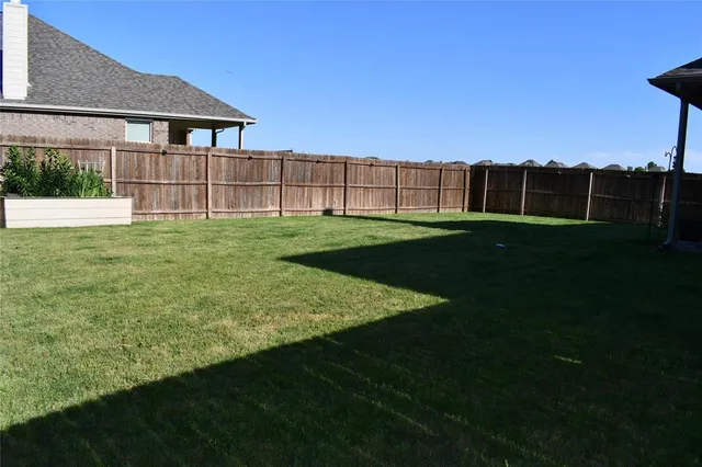 a view of a backyard with a garden