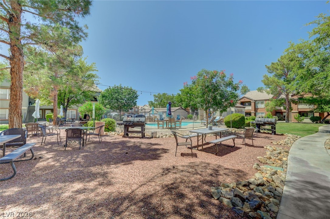 555 East Silverado Ranch Boulevard, Unit 2124 Las Vegas, NV 89183 - Photo 4 of 47 Enjoy al fresco dining and poolside relaxation in this vibrant outdoor amenity space.