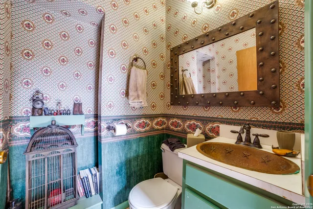 a bathroom with a tub sink and mirror