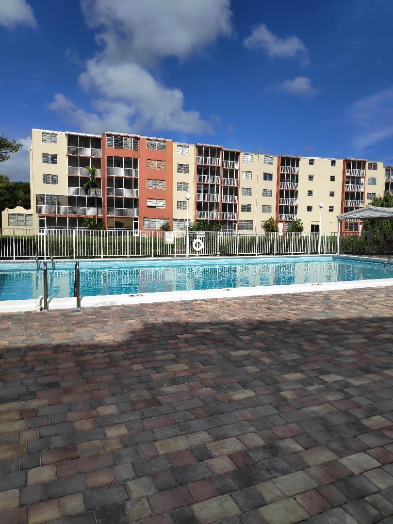 1680 Northeast 191st Street, Unit 2182 Miami, FL 33179 - Photo 1 of 8 a view of a city from a terrace