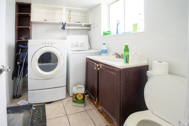 1347 South 400 East Springville, UT 84663 - Photo 10 of 20 Compact utility space featuring a window, built-in shelving, a vanity with a sink, and tile flooring