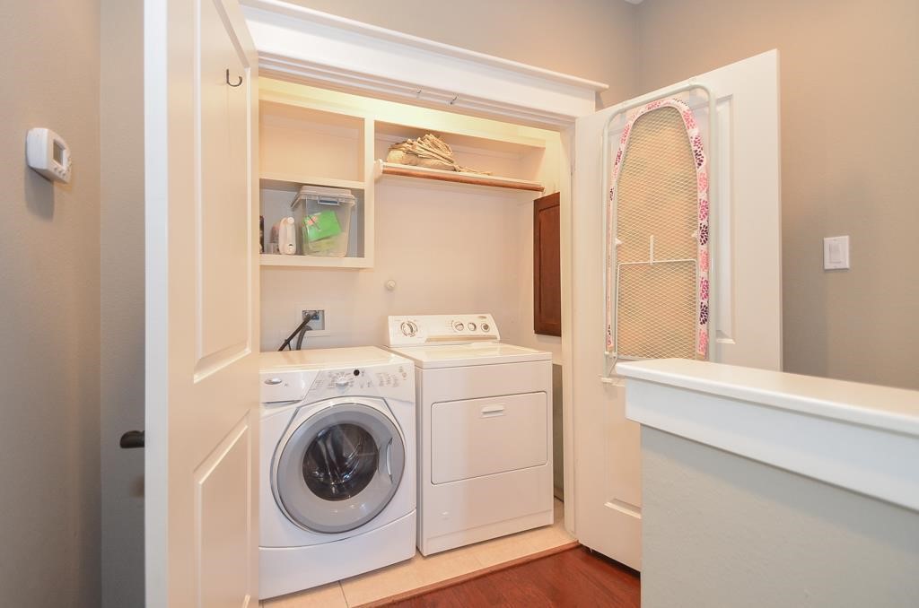 2214 Radcliffe Street Houston, TX 77007 - Photo 13 of 15 a utility room with dryer and washer