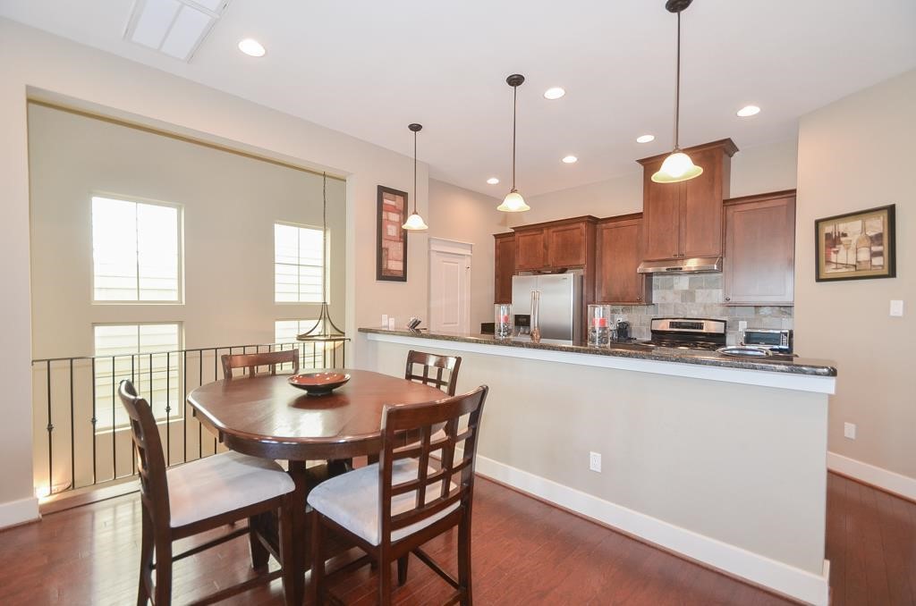 2214 Radcliffe Street Houston, TX 77007 - Photo 3 of 15 a large kitchen with a table and chairs