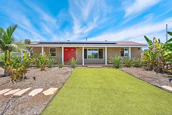 a house view with a garden space