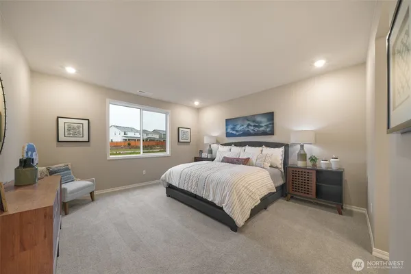 a bedroom with a bed and window