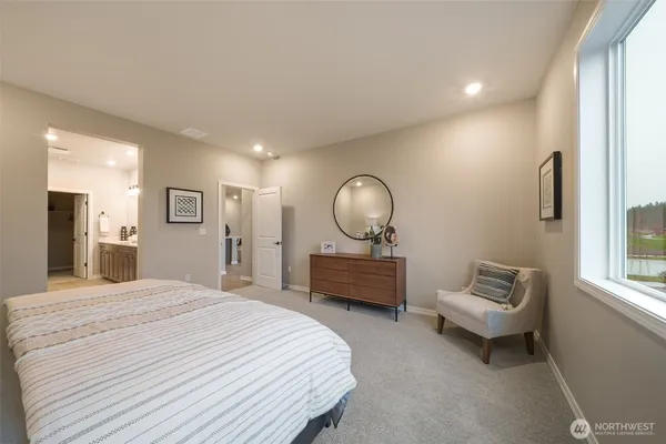 a spacious bathroom with a double vanity sink a mirror and a shower