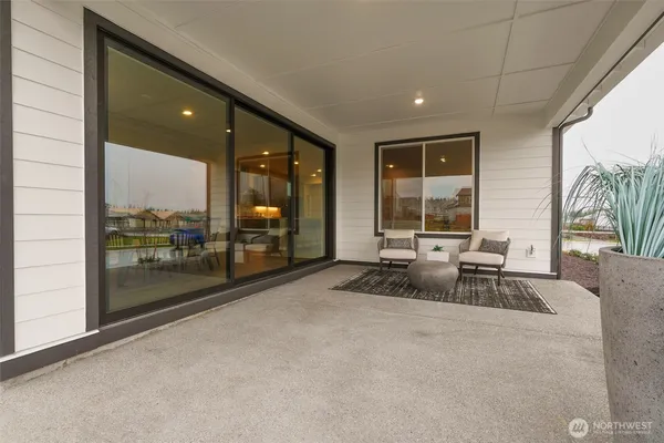 a view of swimming pool with outdoor seating