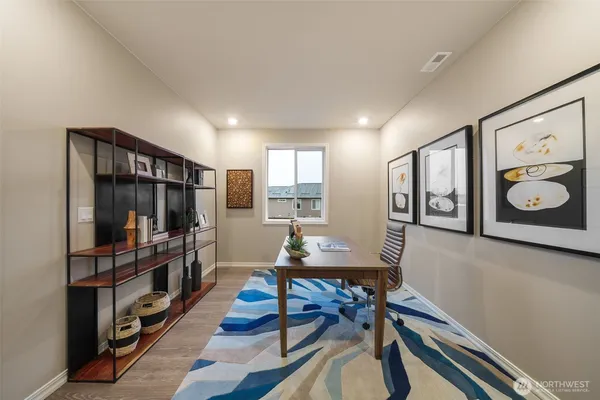 a workspace with furniture and window