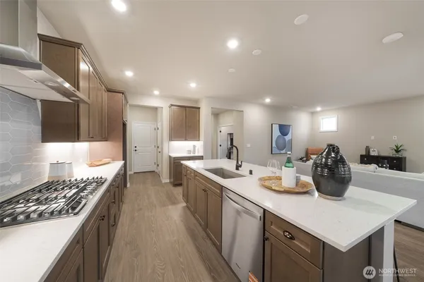a kitchen with lots of counter top space and living room