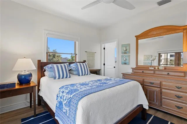 a bedroom with a large bed and a window