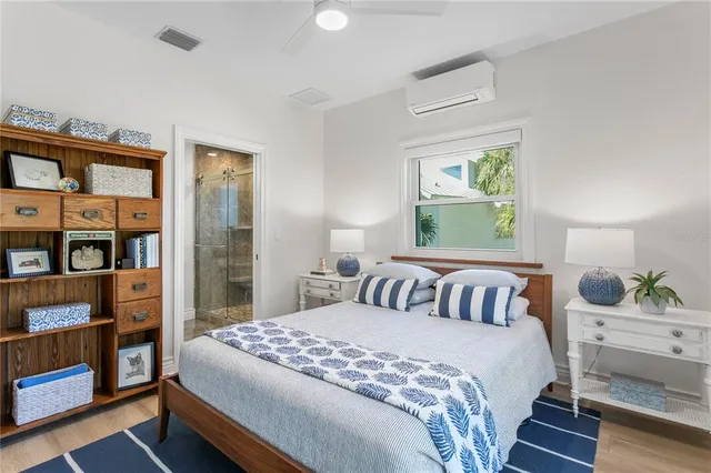 a bed room with a bed and a window