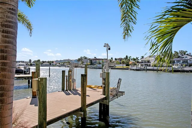 a view of a lake with houses in the back