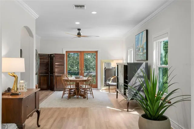 a view of a dining room with furniture window and outside view