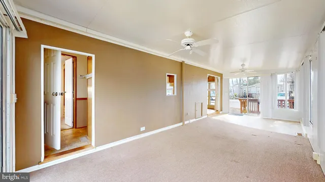 a view of a big room with closet and windows