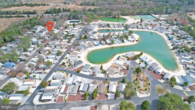 an aerial view of a swimming pool patio yard and outdoor seating
