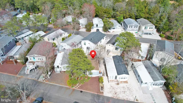 an aerial view of multiple houses with yard