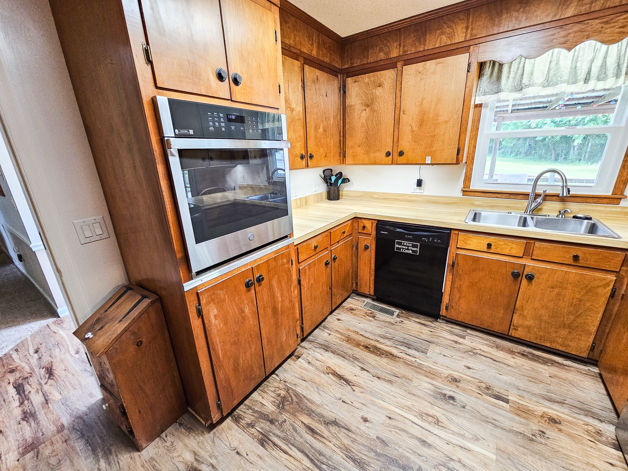 810 Rabbit Branch Road Shelbyville, TN 37160 - Photo 12 of 43 a kitchen with stainless steel appliances granite countertop a sink a stove a microwave a refrigerator and cabinets